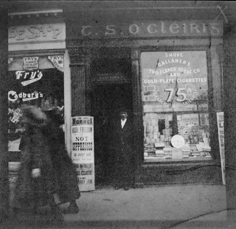 Tom Clarke seen outside his shop at 75a Parnell Street